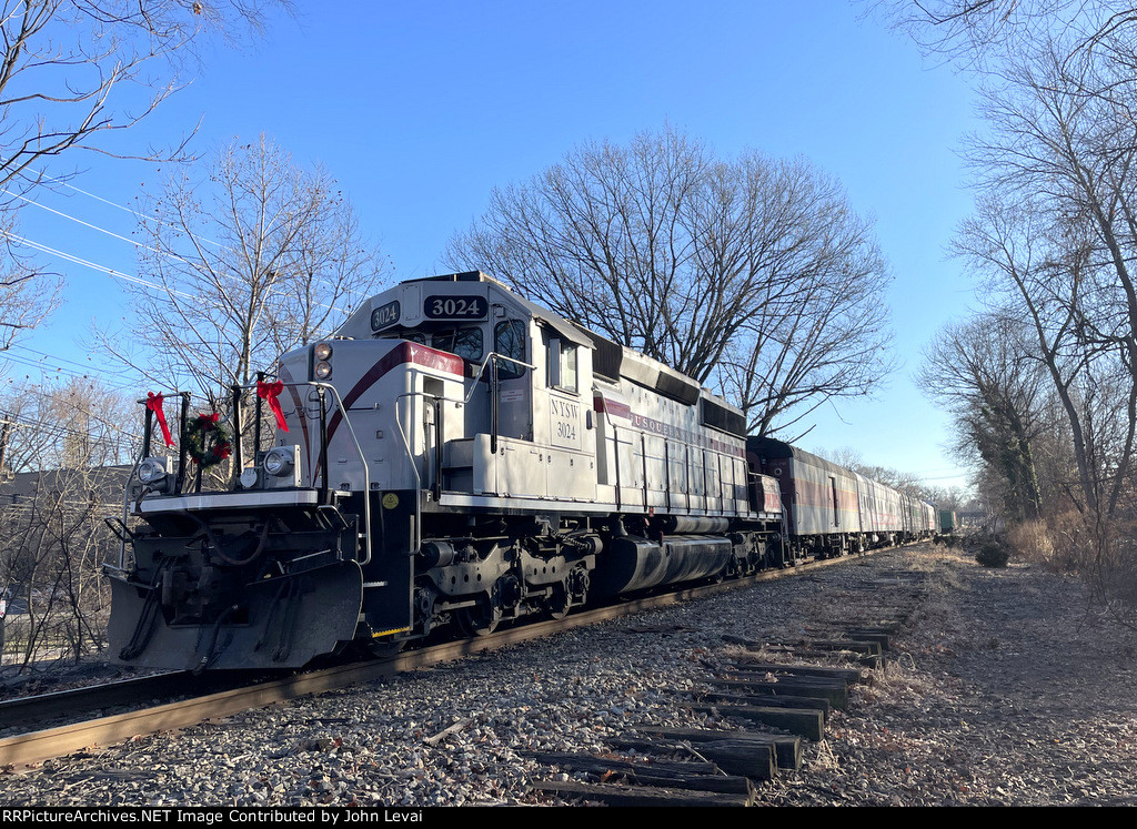 SD40-2 # 3024 sits on the western end of the consist in Rochelle Park